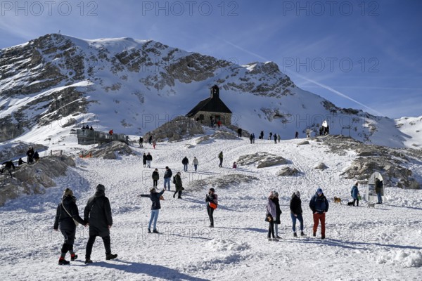 Tourists at the Heimsuchung chapel on Zugspitzplatt, Grainau municipality, Garmisch-Partenkirchen district, Bavaria, Germany