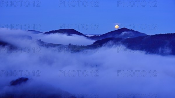 View from the Gisliflue of the Jurassic foothills covered in fog from the left, Asperstrihen, Strihen, in the light of the full moon, Talheim, Canton, Aargau, Switzerland