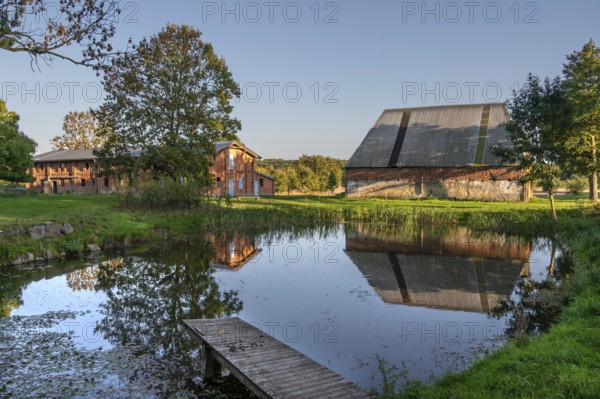 Historic buildings, pig and poultry house and pond of a manor from 1923, Othesdorf, Mecklenburg-Western Pomerania, Germany