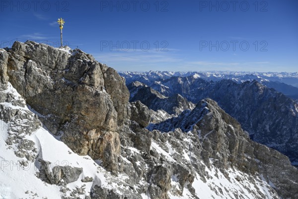 Zugspitze summit cross (2962 m), in the background the Wetterstein Mountains, Grainau municipality, Garmisch-Partenkirchen district, Bavaria, Germany