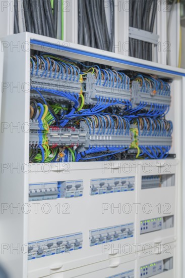 Detailed cable system in the control box with blue and black cables