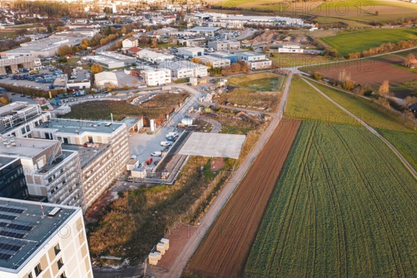 Outskirts of town with fields and construction areas, roads lead through rural surroundings, new hospital, Calw health campus, Black Forest, Germany
