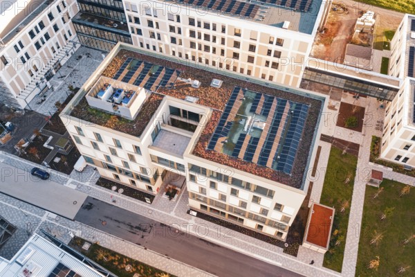 Detail of a green roof with solar panels on a modern building, new hospital, Calw Health Campus, Black Forest, Germany