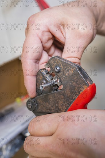 Close-up of rusty hand tools held by one hand