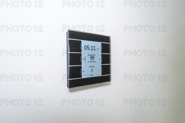 A switch with a display on a white wall