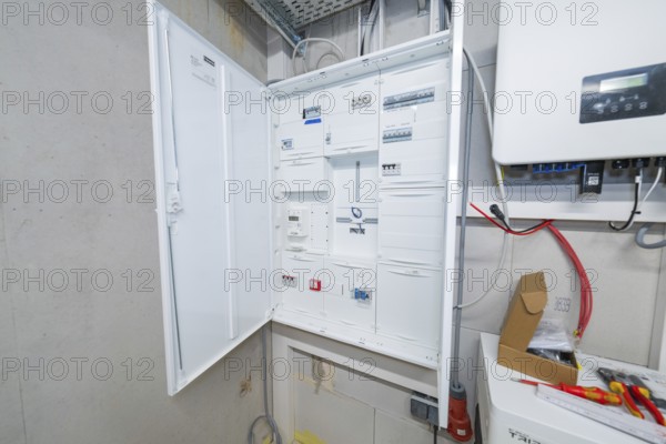 Detailed view of an electrical cabinet with open control boxes in the technical room