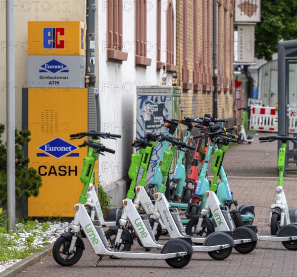 Electric scooters and rental bikes on public roads, Berlin, Germany