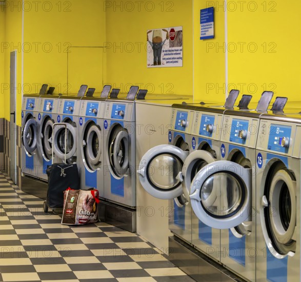 Washing machines in a public laundromat, Frankfurt am Main, Hesse, Germany