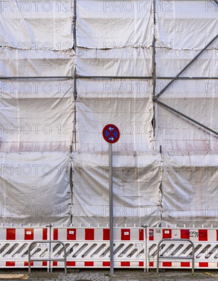 White construction plans cover the entire construction site of a building, Ziegelstraße, Berlin, Germany