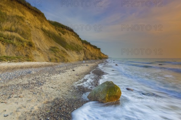 Sea cliffs and crumbling shoreline at sunset near Wustrow on the Fischland peninsula along the Baltic Sea, Mecklenburg-Vorpommern, Germany