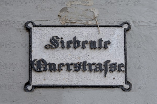 Seventh Cross Road, a historic street sign in the old town, Hanseatic City of Lübeck, Schleswig-Holstein, Germany