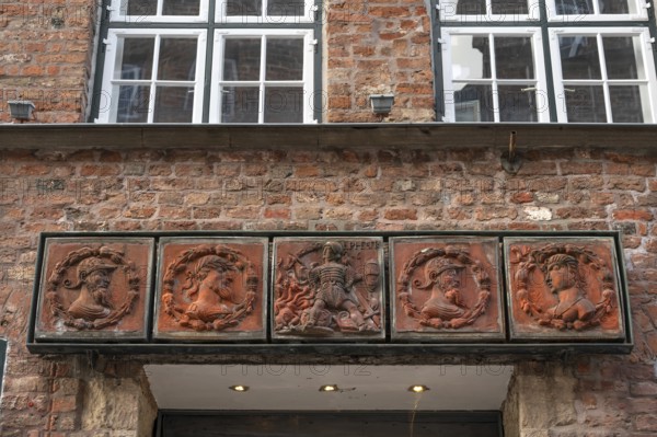 Terracotta decoration above the entrance to the Schabbelhaus, a Renaissance building built in 1558, renewed after an explosion in 1562, Mengstr, 48 Hanseatic City of Lübeck, Schleswig-Holstein, Germany