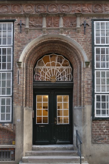 Entrance of a historic residential building with terracotta decoration, built around 1560, Mengstraße 27, Hanseatic City of Lübeck, Schleswig-Holstein, Germany