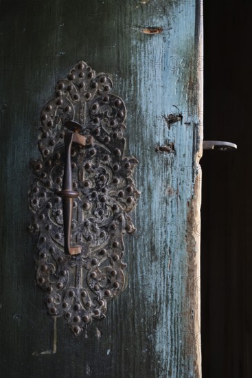Wrought iron door lock with handle, Maihaugen open-air museum with houses and objects from farms in Gudbrandsdal, Lillehammer am Mjøsa Lake, Innlandet Municipality, Norway