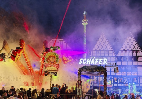 Colourful evening rides in front of half-timbered houses at the All Saints Fair, Altstadt, Soest, North Rhine-Westphalia, Germany