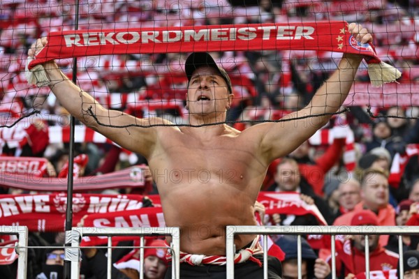 Ultra, well-known fan of FC Bayern Munich, always with upper body naked, even in freezing temperatures, fan block, fans, fan curve, flags, mood, atmospheric scarves record champion, Allianz Arena, Munich, Bayern, Germany
