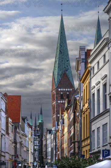 Shopping street with historic houses and the towers of St. Mary's Church, Hanseatic City of Lübeck, Schleswig-Holstein, Germany