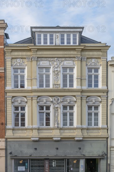 Decorative façade of the upper floors of a residential building, built in 1884, Hanseatic City of Lübeck, Schleswig-Holstein, Germany
