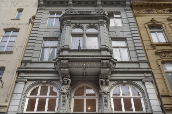 Bay window with caryatids on a historic house, 19th century, Hanseatic City of Lübeck, Schleswig-Holstein, Germany