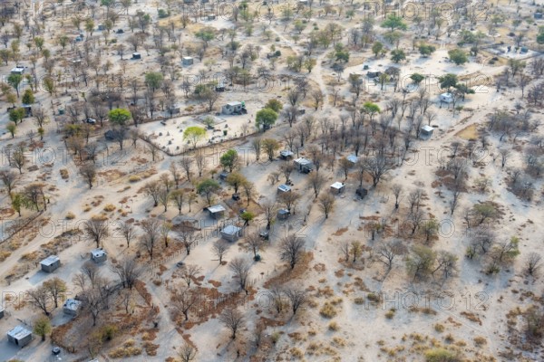 Settlement, simple house and fence, dry savanna landscape, near Maun, aerial view, Okavango Delta, Botswana