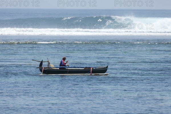 Fishing outrigger boat off Sanur beach, Bali, Indonesia