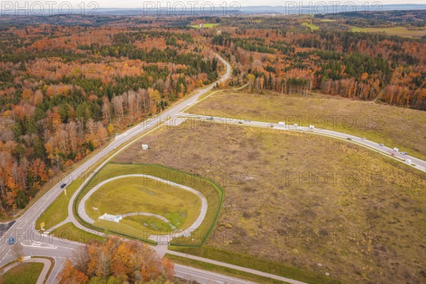 Extensive autumn landscape with crossroads surrounded by forests, new Lindenrain industrial park, Calw, Black Forest, Germany
