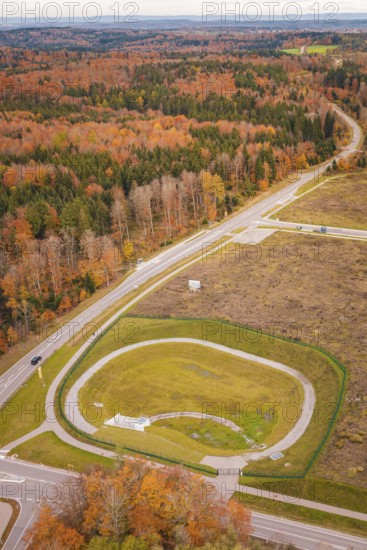 Roundabout surrounded by autumn leaves and extensive countryside, new Lindenrain industrial park, Calw, Black Forest, Germany
