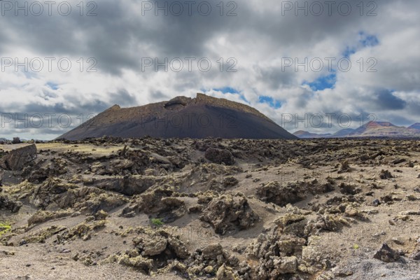 Lava field covered with lichens, Parque Natural de Los Volcanes, near Masdache, Lanzarote, Canary Islands, Spain