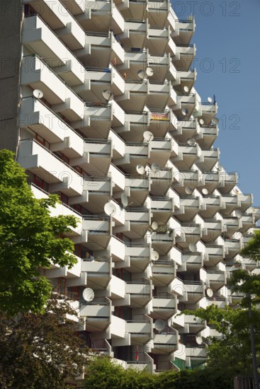 High-rise apartment building with balconies and satellite dishes, satellite town of Chorweiler in Cologne, North Rhine-Westphalia, Germany