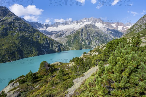 Turquoise blue mountain lake Göscheneralpsee, picturesque mountain landscape with dammastock and damma glacier, Göscheneralp, Canton of Uri, Switzerland