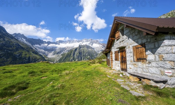 Alpine hut in picturesque mountain landscape with dammastock and damma glacier, Göscheneralp, Canton of Uri, Switzerland