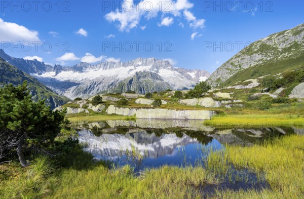 Picturesque mountain landscape, dammastock and damma glaciers reflected in Moorsee, Göscheneralp, Canton of Uri, Switzerland