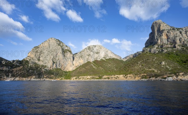 Picturesque rocky coast, cliffs and blue sea, Golfo di Orosei, Baunei, Sardinia, Italy