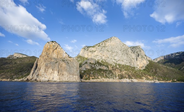 Picturesque rocky coast, cliffs with Pedra Longa pinnacle, blue sea, Golfo di Orosei, Baunei, Sardinia, Italy
