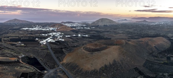 Picturesque volcanic landscape with volcanic craters Montaña de la Tabaiba at sunrise, Parque Natural de Los Volcanes, aerial view, Lanzarote, Canary Islands, Spain