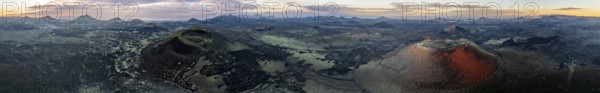 Panorama, Caldera Colorada volcano and Montaña Negra, picturesque volcanic landscape with volcanic craters at sunrise, Parque Natural de Los Volcanes, aerial view, Lanzarote, Canary Islands, Spain
