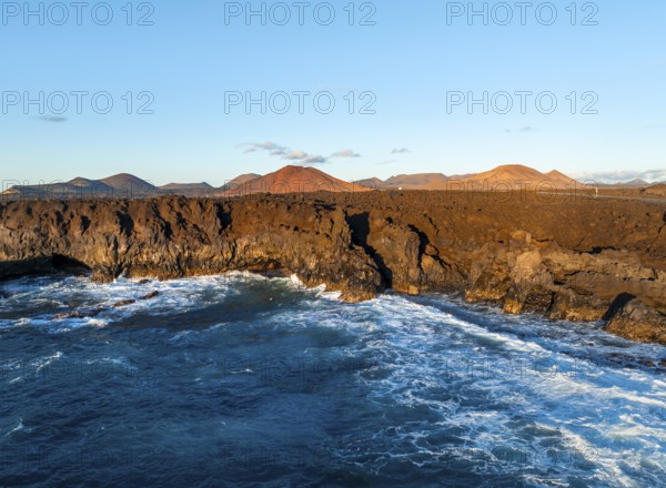 Coast with lava fields, volcanic landscape near Los Hervideros, in the evening light, aerial view, Lanzarote, Canary Islands, Spain