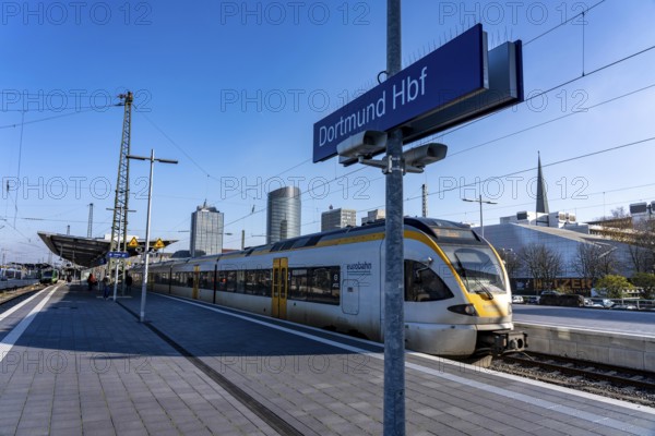 The skyline of the city center of Dortmund as seen from the main train station, Eurobahn train, North Rhine-Westphalia, Germany