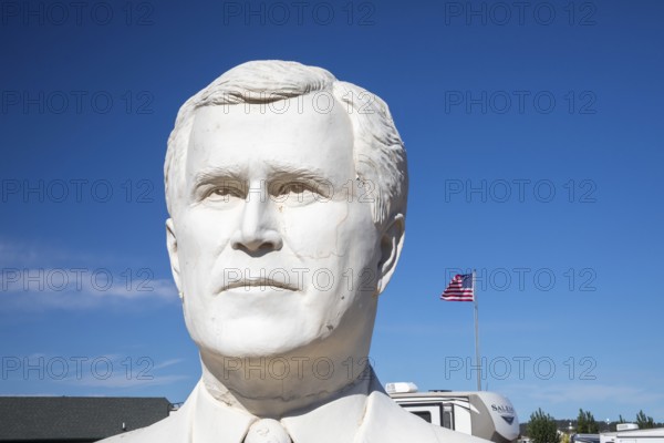Hermosa, South Dakota - The 20-foot-tall head of President George W. Bush, crafted by artist David Adickes. This was one of 43 Presidential heads made for Presidents Park, near Mt. Rushmore. Presidents Park went out of business a few years after opening in 2003