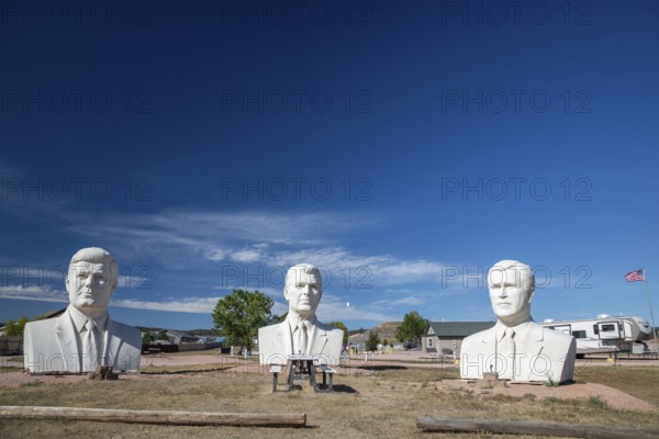 Hermosa, South Dakota - The 20-foot-tall heads of Presidents John Kennedy, Ronald Reagan, and George W. Bush, crafted by artist David Adickes outside an RV park. These were three of 43 Presidential heads made for Presidents Park, near Mt. Rushmore. Presidents Park went out of business a few years after opening in 2003