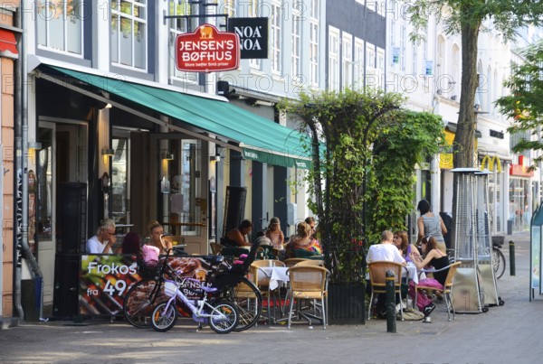 People in street restaurant in Odense, Fyn island, Funen, Denmark, Scandinavia