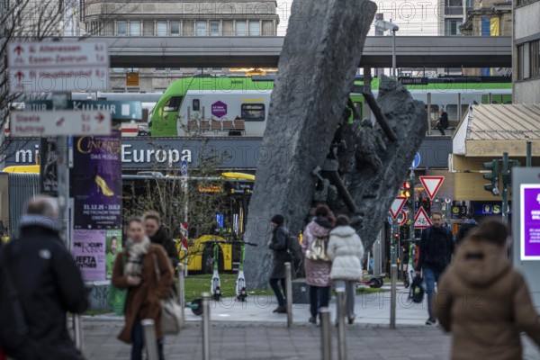 Downtown Essen, passers-by at Europaplatz, main train station, mining monument Steile Lagerung, North Rhine-Westphalia, Germany