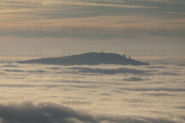 Sunset over a sea of fog from Beurener Fels to Mount Jusi, Swabian Alb, Baden-Württemberg, Germany