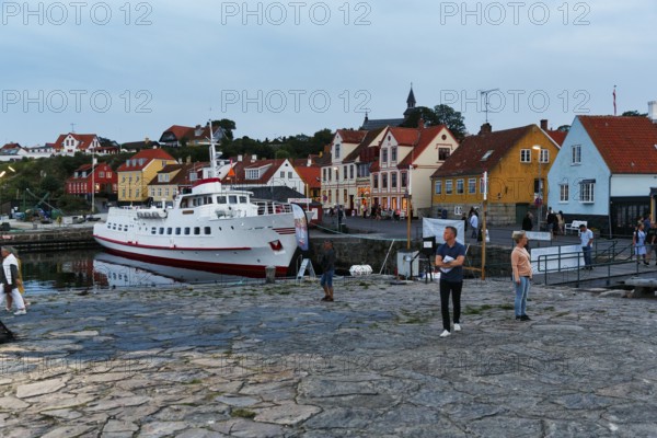 Harbour town, fishing village with half-timbered houses and ferry to the Pea Islands, Christiansø, dusk, Bornholm island, Denmark