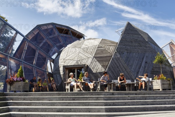 Modern roof structure made of wood and glass, modern architecture, visitors in front of Domen Cultural Center, Allinge, Bornholm, Denmark