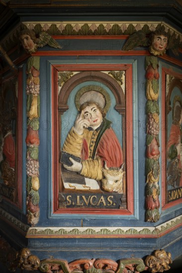 Wooden relief of Evangelist Luke on pulpit decorated with angels and fruits by Peder Knudsen Kjørsvik, Maihaugen open-air museum with houses and objects from farms in Gudbrandsdal, Lillehammer am Mjøsa Lake, Innlandet Municipality, Norway