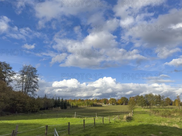 Below white clouds Stratocumulus and Cumulus, above cumulus clouds, Germany
