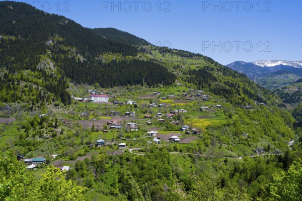 Villages nestled in a green mountain landscape with blue sky, Paksadzeebi, Ajara region, Ajara, autonomous republic, Georgia