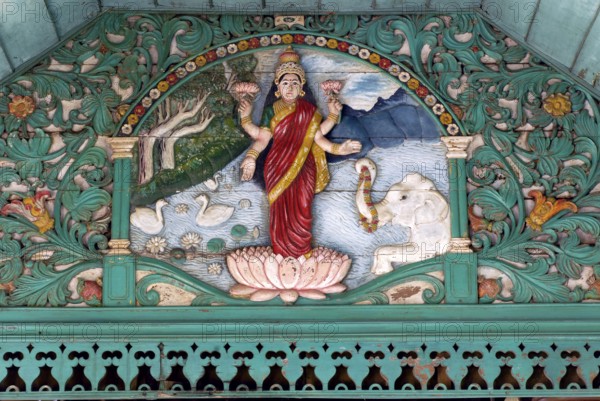 Painted wooden relief, Hindu goddess Lakshmi, goddess of luck, love, fertility, prosperity, health and beauty, Kalari Kovilakom, Ayurveda Palace of the Cgh-Earth Hotel Group, Kollengode, Vengunad, Kerala, India