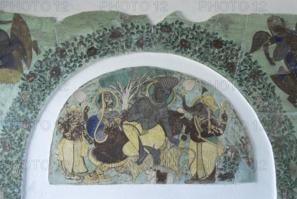 Ancient frescoes depicting Hindu gods Ganesha and Shiva, Devigarh Palace Hotel, near Udaipur, Rajasthan, India